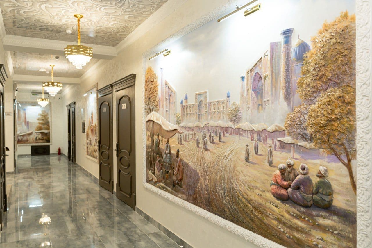 Hotel corridor with a hand-painted mural of Registan Square